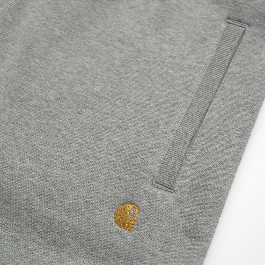 Carhartt WIP Chase Sweat Pant - Grey Heather / Gold Logo Close Up